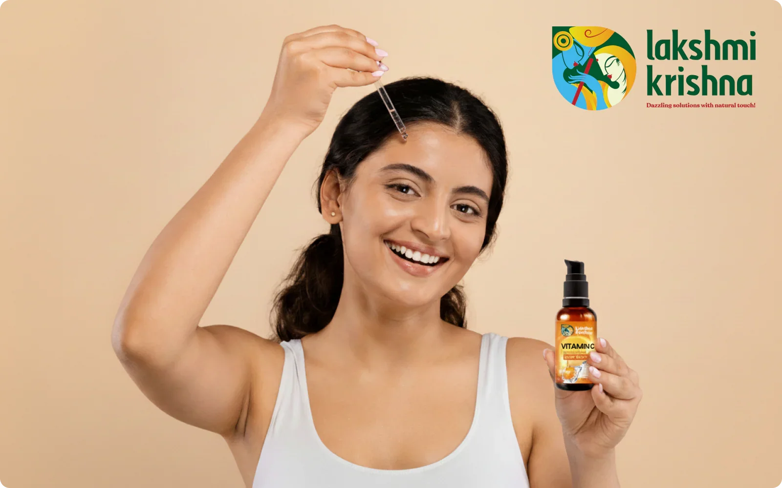 Smiling woman applying Lakshmi Krishna Vitamin C face serum with dropper on beige background